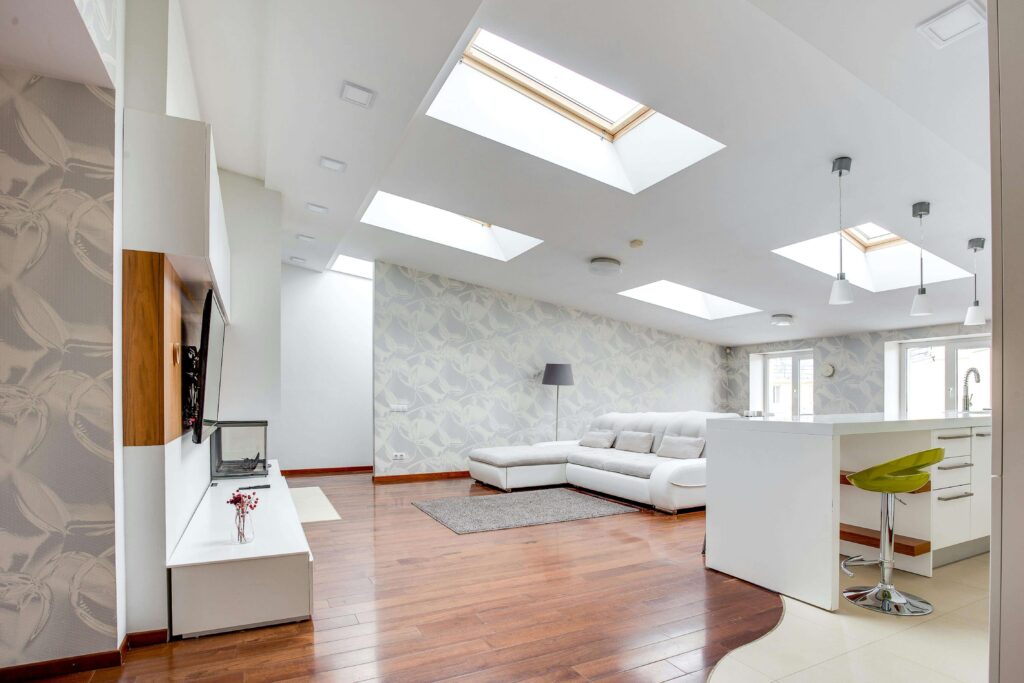 Open plan living kitchen with four skylights 