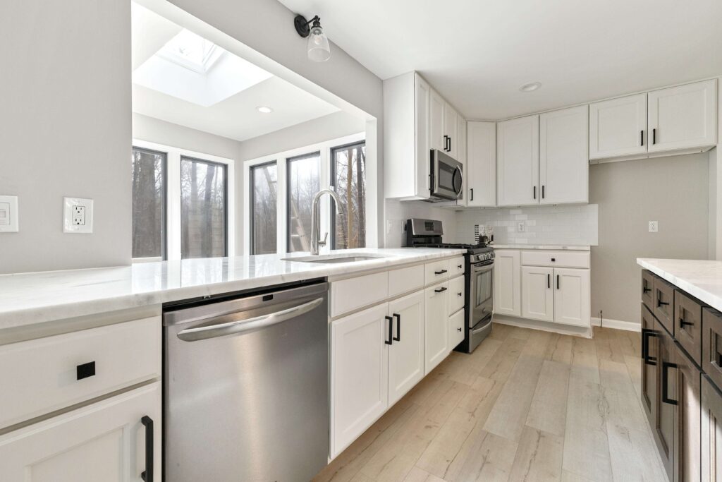 White countertop kitchen with skylight