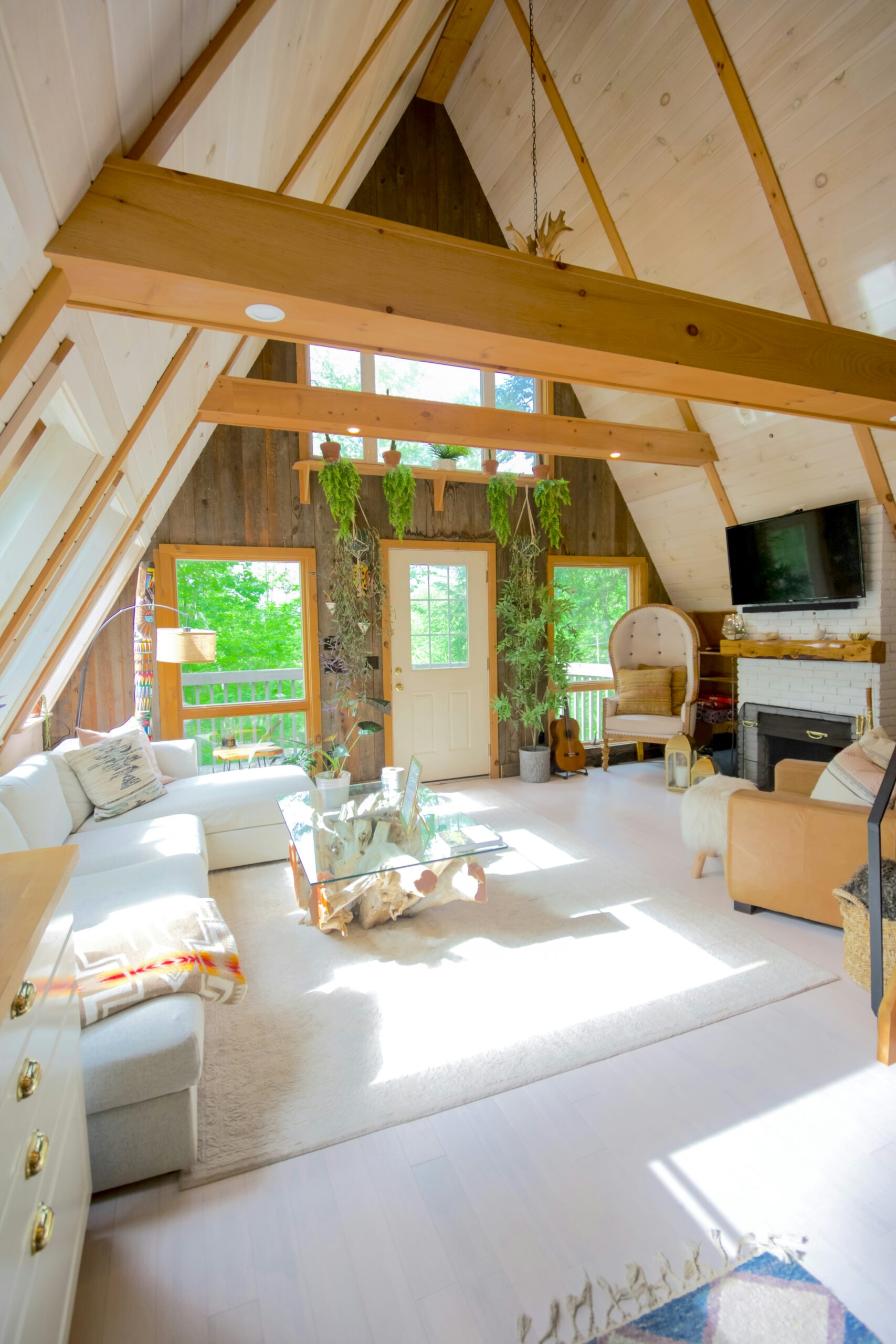 Beautiful home with wooden features, white couch and large windows